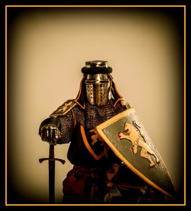 Kneeled medieval knight with sword and shield